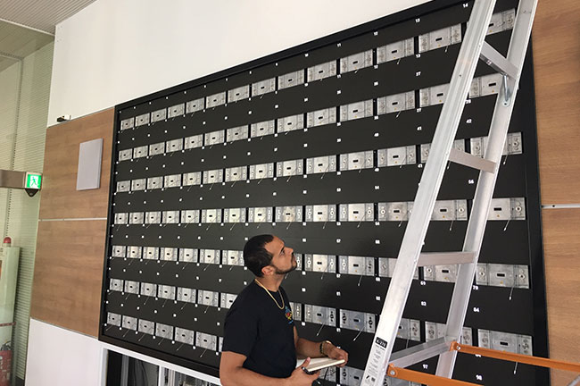 An LED technician installing MicroTiles LED