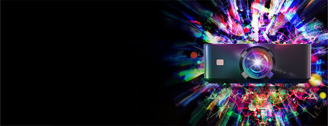 Korus projector with an multicolor explosion motif behind it.