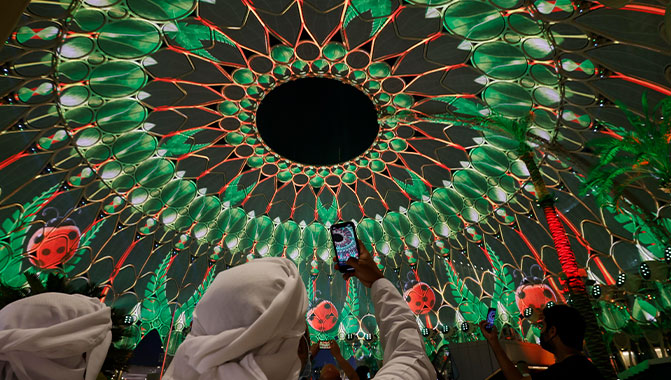 Visitors watch light projections at Al Wasl Dome: Photo by David Jiminez/Expo 2020 Dubai 