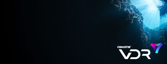 The VDR logo over an image of an ocean reef, showing the darkest water at the bottom and sunlight streaming through the surface at the top.