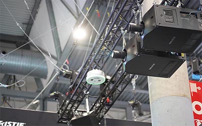 Griffyn 4K50-RGB projectors suspended above the action in our booth.