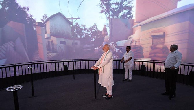 Indian Prime Minister Narendra Modi viewing the projections during his visit to Smritivan Earthquake Museum.