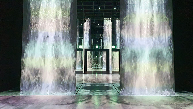 Visitors can interact with the virtual waterfall in “Echo of Soul”, made possible using nine Christie GS Series projectors.