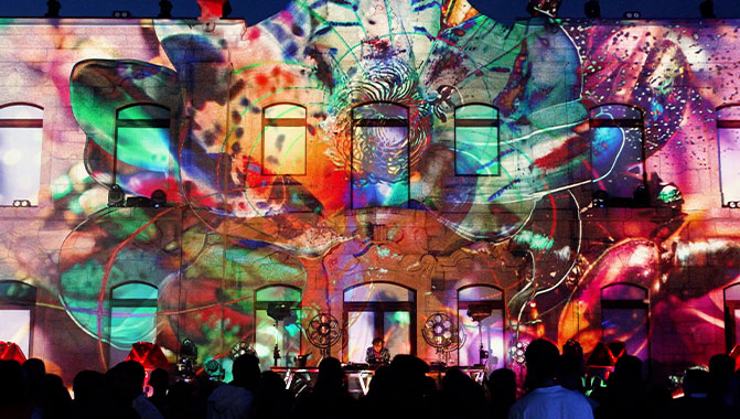 Projection mapping on the facade of a building. Photo credit @ADCL Audiovisuais