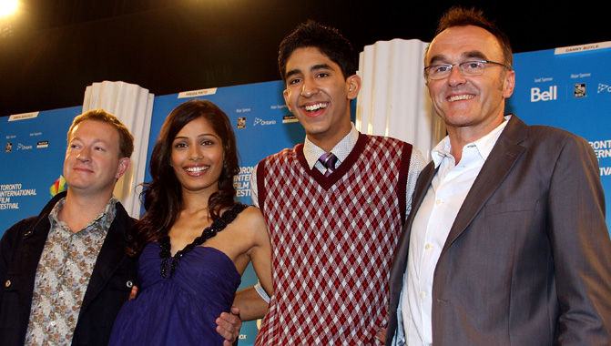 Throwback to 2008 with (L-R) Writer Simon Beaufoy, actors Freida Pinto, Dev Patel and director Danny Boyl speak at the "Slumdog Millionaire" press conference, TIFF 2008 - Photo credit Haidee Malkin/WireImage