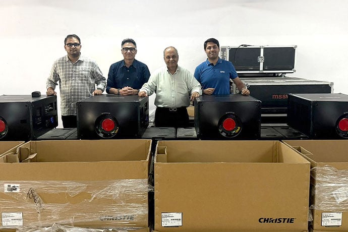 MSS World’s Davinder Wadhwa (third from left) and Pratik Wadhwa (far right) are pictured with the first batch of delivered Griffyn 4K50-RGB projectors, joined by Rishubh Nayar, Christie’s ProAV sales director for India (second from left), and Sachin Singh, national sales manager (far left)