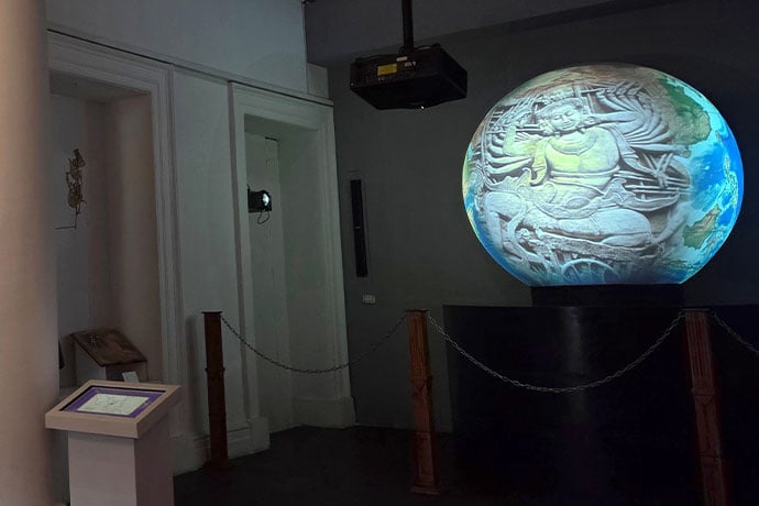 Inspire Series projectors illuminate a globe with vivid visuals.
