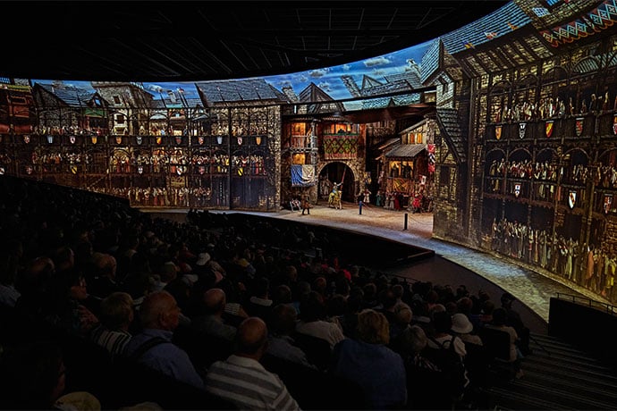 The show combines moving scenery, live performance, and immersive projection in a unique rotating theatre.