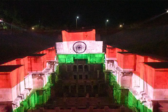 The projections draw their inspiration from Patan Patola textiles, historic water structures, and spiritual symbols.