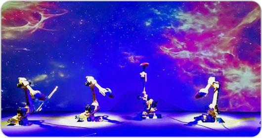 Left: Dancing robotic arms with projections by Christie DWU850-GS laser projectors in the backdrop. Right: The breathtaking full dome flying theater named “Wing of Cosmos” uses eight D13WU-HS laser projectors (Photo courtesy of D.L.T Group)