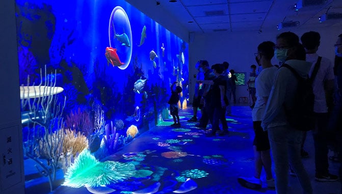 Visitors enjoying lifelike projections using Christie visual solutions at the newly opened Xpark Aquarium (Photos courtesy of Dacoms Technology)