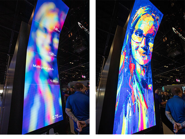 Two tall, slightly curved LED video wall displays beside each other showing the image of a woman’s face blurry on one, and in high resolution on the other.