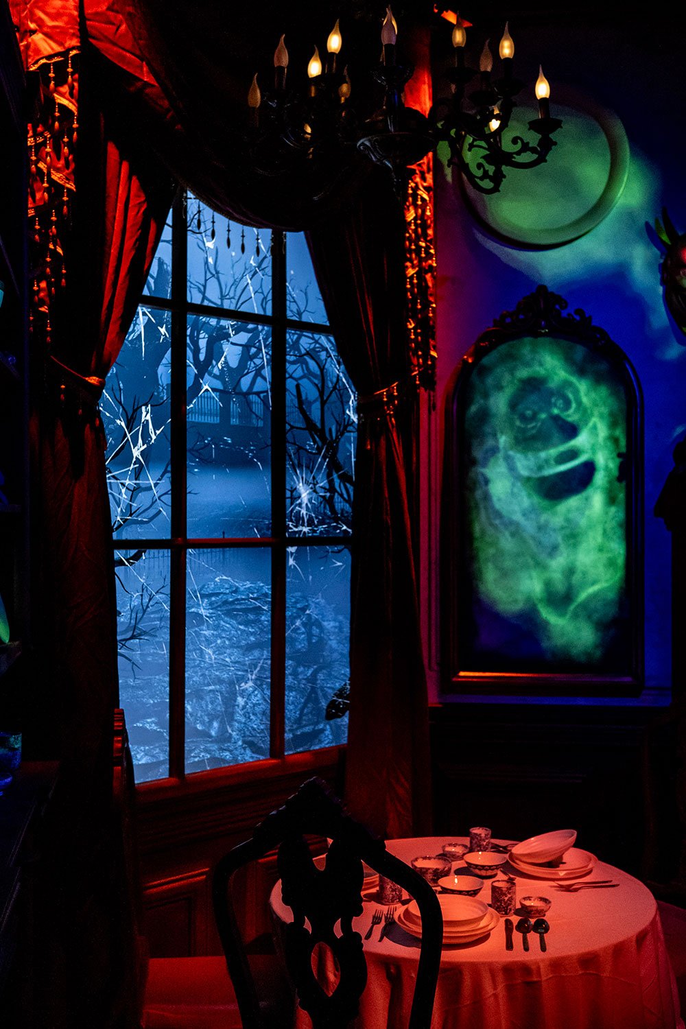 A window and wall covered with projected images.