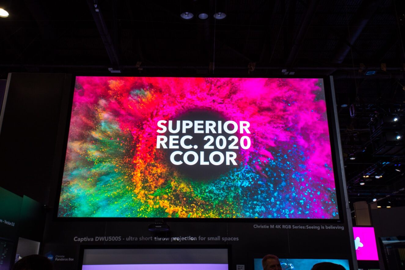 Screen with projection of colorful powders filling up the screen and the words "SUPERIOR REC. 2020 COLOR'' in white